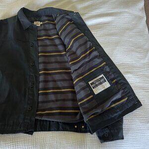 Flint and Tinder Flannel-Lined Waxed Trucker Jacket in Coal